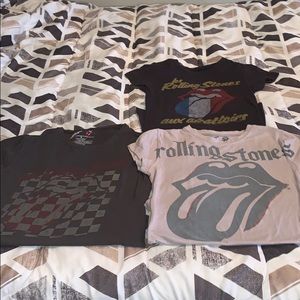 Three Rolling Stones shirts.